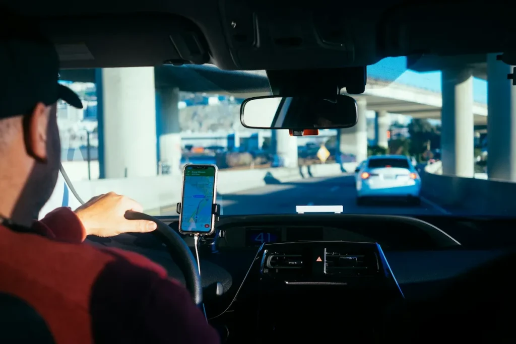 Driver navigating toward Keflavik Airport for a comfortable airport taxi transfer in Iceland.