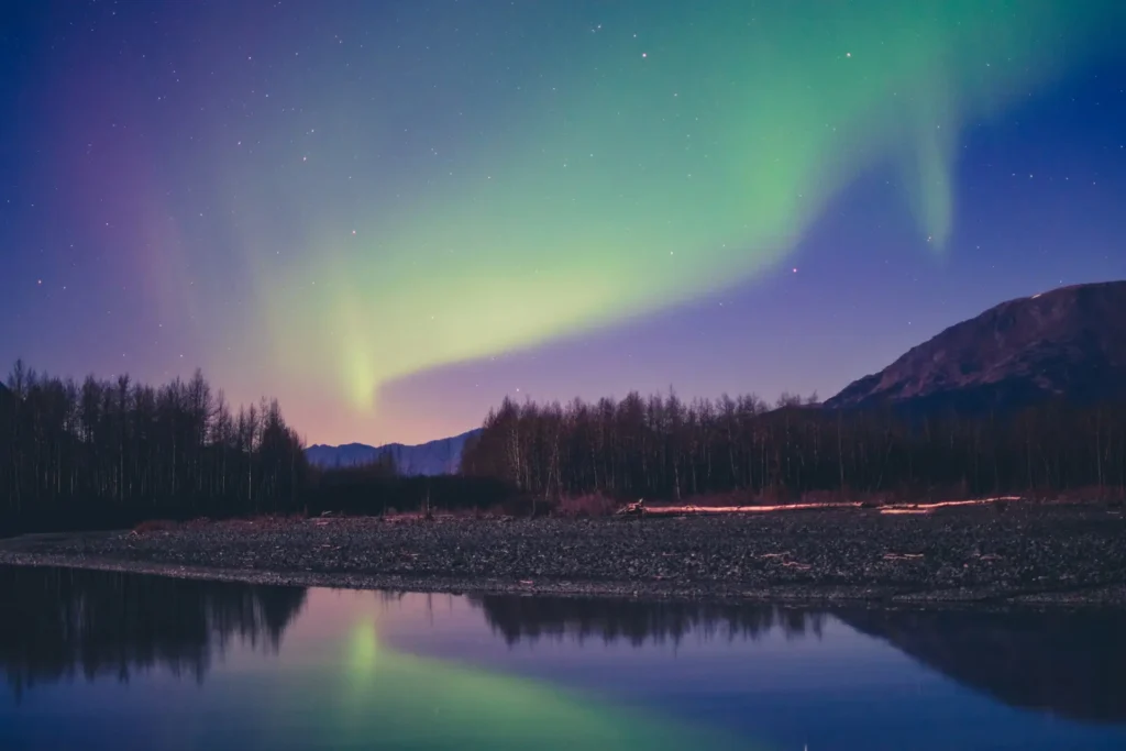 Northern Lights reflecting over a lake in Iceland